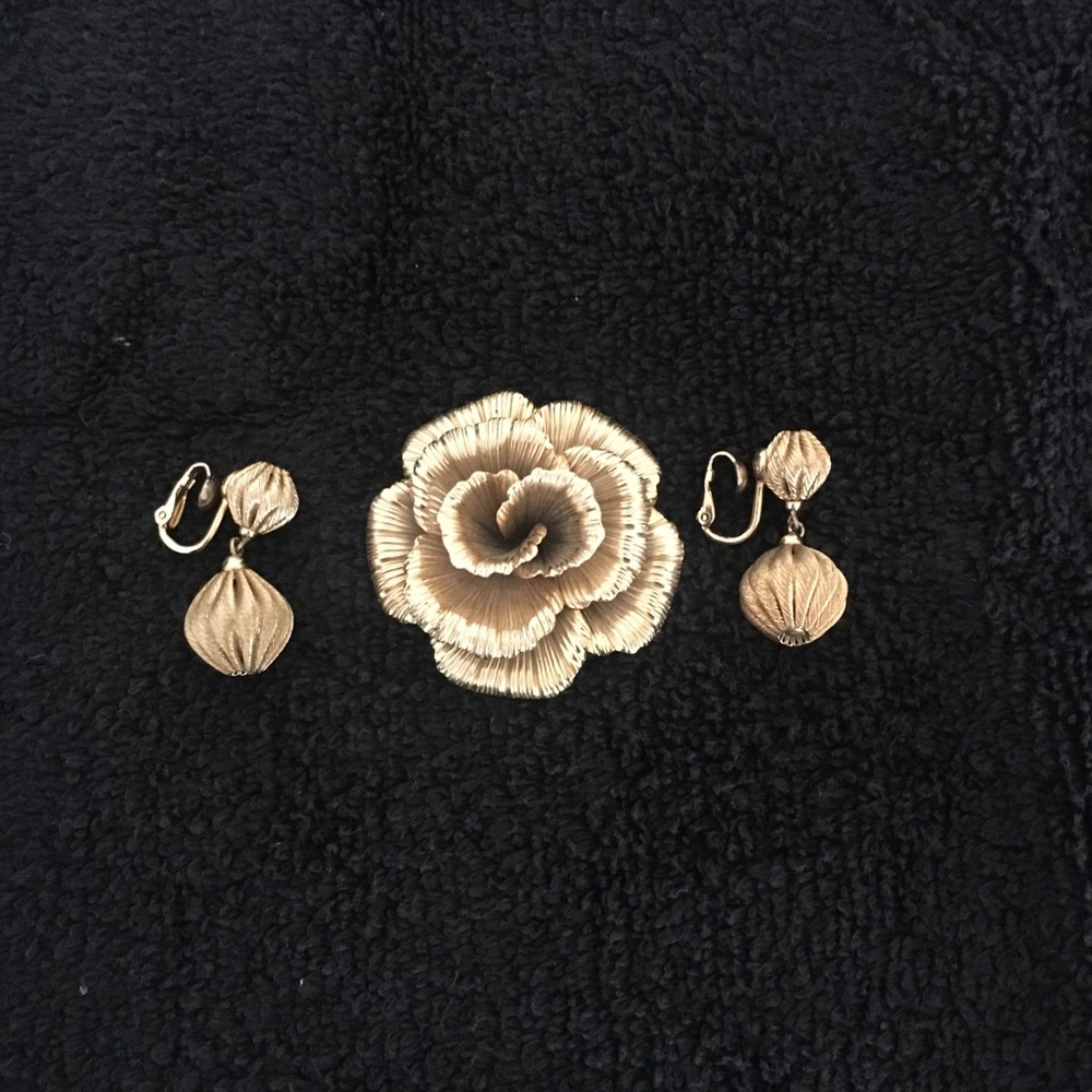 Gold vintage earrings with matching pin .